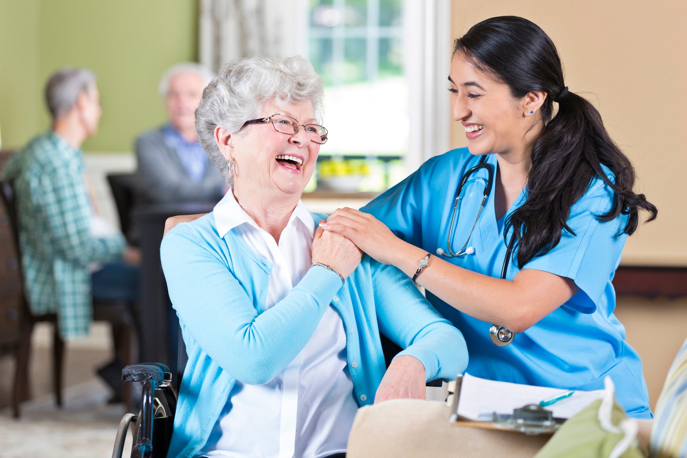 Nursing home nurse with senior patient